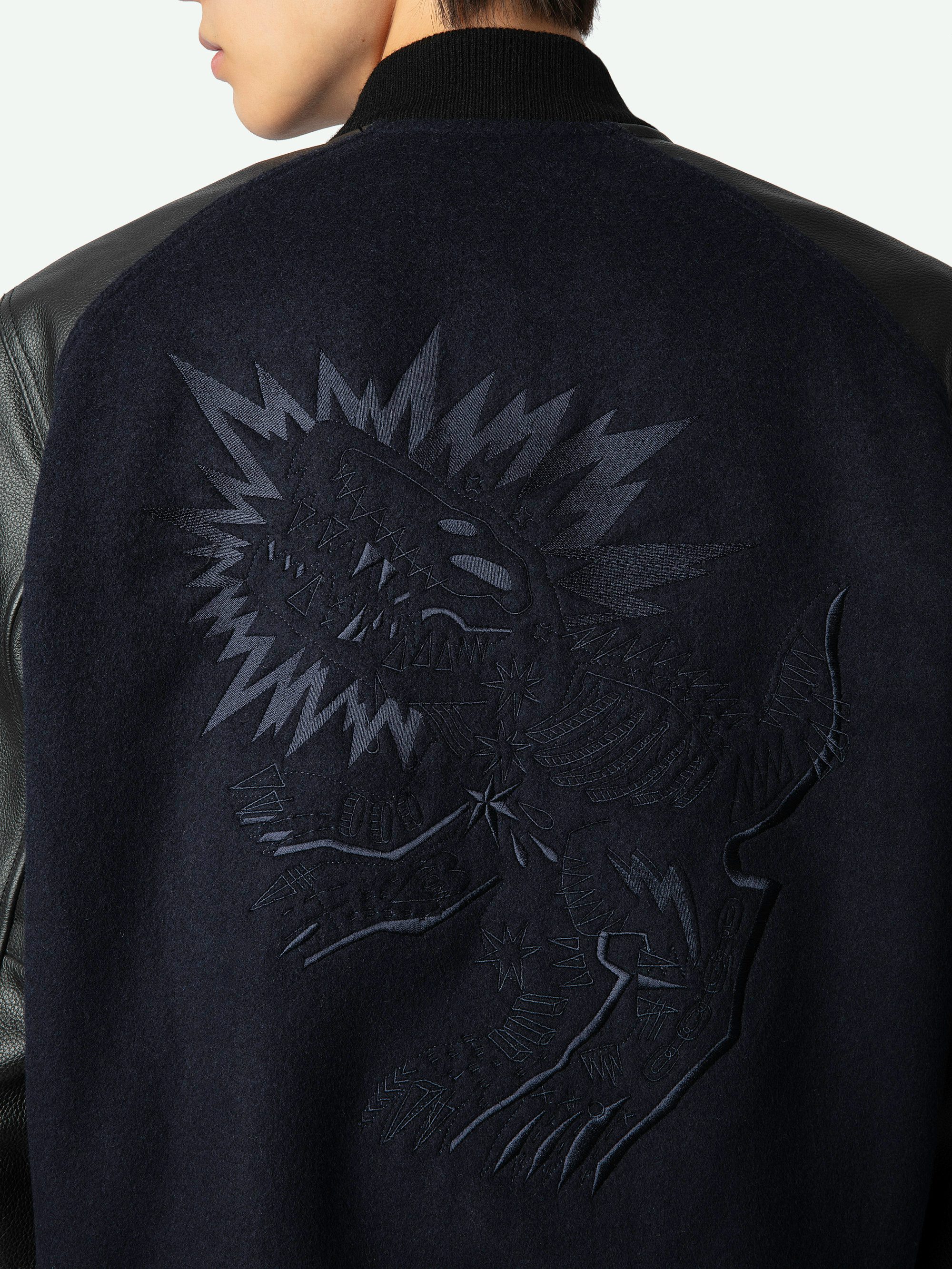 Birdieh Bomber Jacket - Blue wool bomber jacket with patterned grained leather pockets and panels, embroidery and XO skull badge.